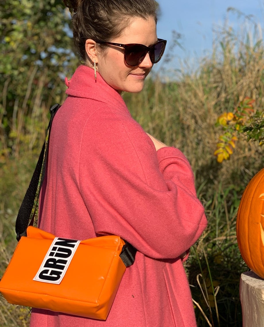 Designer orange bag on sale